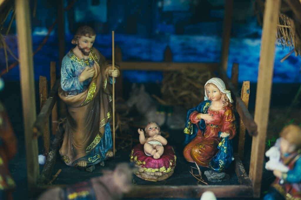 a nativity scene with figurines of jesus and baby jesus